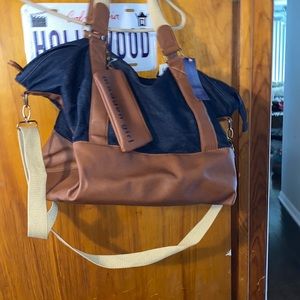 Madden Girl by Steve Madden Weekender bag with shirt and long straps.